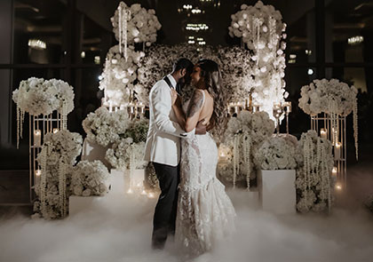 Romantic wedding ceremony with floral arches