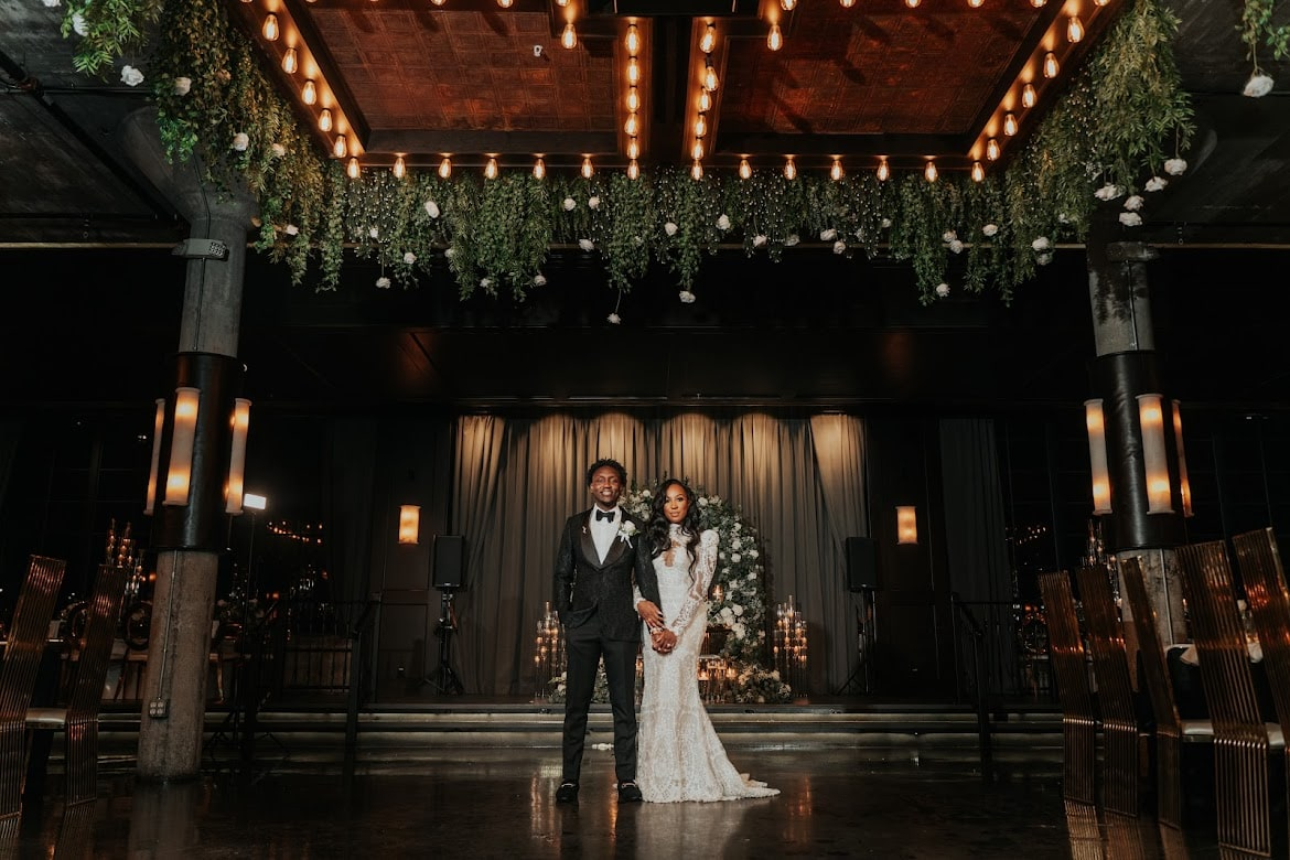 Couple under hanging greenery