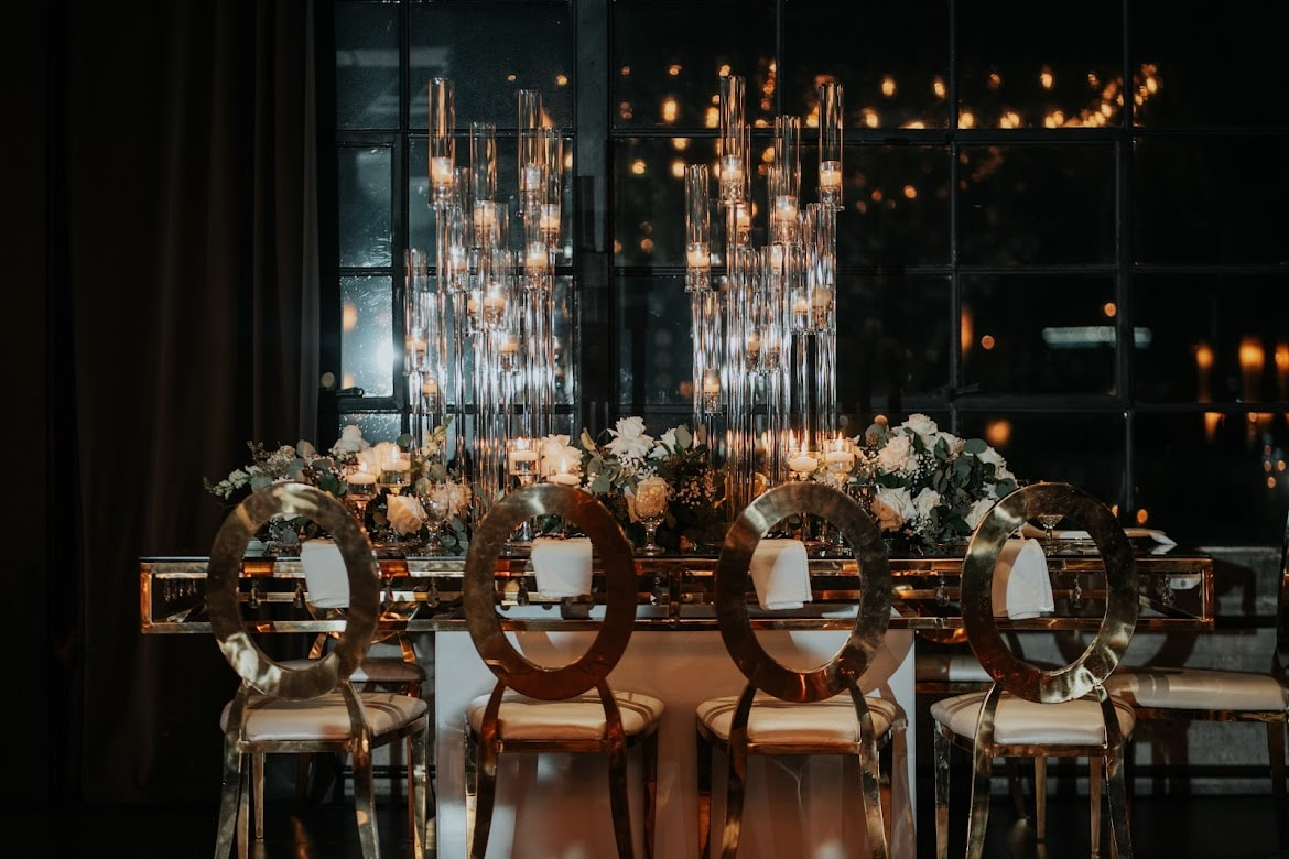 Gold ring chairs and candle centerpieces